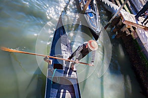 Gondolier on Grand Canal in Venice, Italy