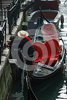 Gondolier preparing boat for tourists,Venice