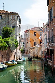 A gondolier on a quiet Venetian channel