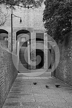 Gondolier rowing gondola with tourist on a canal in Venice, ItalyArchitectural detail of apartment building in brutalist style in