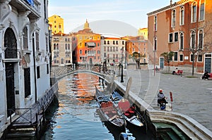 Gondolier is waiting for tourists in Venice.