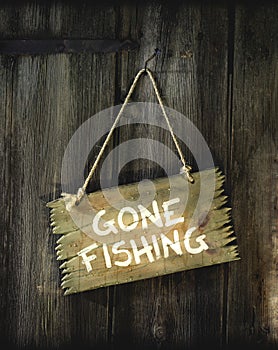 Gone fishing painted on a sign.