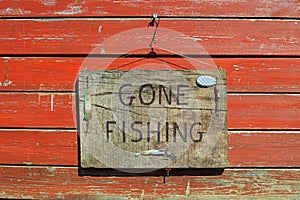 Gone Fishing Sign On A Wooden Plaque