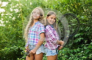 Gone Fishing. two girls fishing. Big game fishing. summer hobby. happy children with net and rod. summer holidays