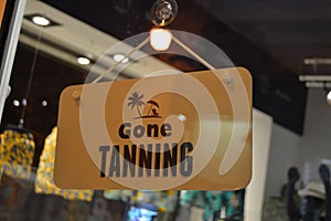 Gone tanning door closed sign