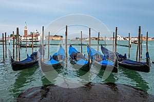 Gongolas and Abbazia in Venice