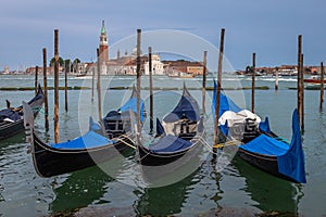 Gongolas and Abbazia in Venice