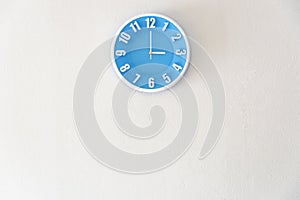 Good afternoon or after midnight with 3:00 clock on white concrete wall interior background with copy space, message board