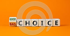 Good or bad choice symbol. Turned a wooden cube and changed words `bad choice` to `good choice`. Beautiful orange background,