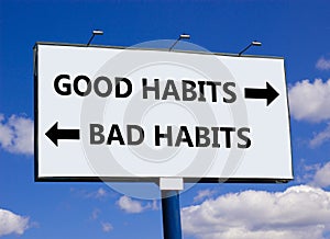 Good or bad habits symbol. Concept word Good habits Bad habits on beautiful billboard with two arrows. Beautiful blue sky with