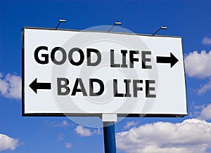 Good or bad life symbol. Concept word Good life Bad life on beautiful billboard with two arrows. Beautiful blue sky with clouds