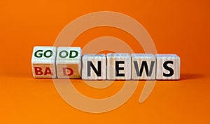 Good or bad news concept. Fliped cubes and changed the words `bad news` to `good news`. Beautiful orange background. Business