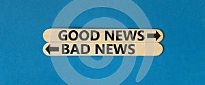 Good or bad news symbol. Concept word Good news Bad news on beautiful wooden stick. Beautiful blue table blue background. Business