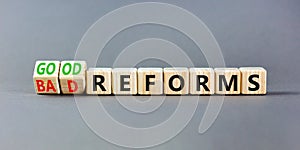 Good or bad reforms symbol. Concept words Good reforms Bad reforms on beautiful wooden blocks. Beautiful grey table grey