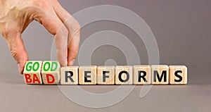 Good or bad reforms symbol. Concept words Good reforms Bad reforms on beautiful wooden blocks. Beautiful grey table grey