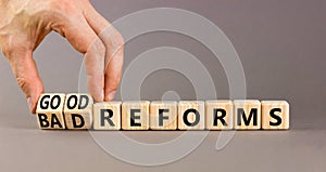 Good or bad reforms symbol. Concept words Good reforms Bad reforms on beautiful wooden blocks. Beautiful grey table grey