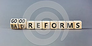 Good or bad reforms symbol. Concept words Good reforms Bad reforms on beautiful wooden blocks. Beautiful grey table grey