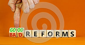 Good or bad reforms symbol. Concept words Good reforms Bad reforms on beautiful wooden blocks. Beautiful orange table orange