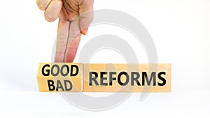 Good or bad reforms symbol. Concept words Good reforms Bad reforms on beautiful wooden blocks. Beautiful white table white