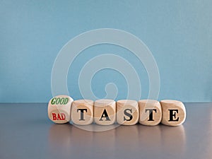Good or bad taste symbol. Turned a wooden cube and changes red words \'bad taste\' to \'good taste\'