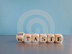 Good or bad taste symbol. Turned a wooden cube and changes words \'bad taste\' to \'good taste\'.