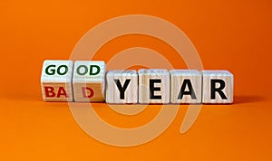 Good or bad year concept. Fliped cubes and changed the words `bad year` to `good year`. Beautiful orange background. Business