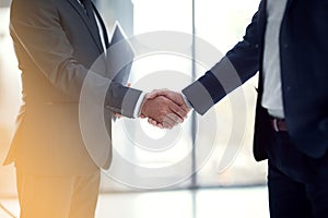 Good businesses requires good communication. two businessmen shaking hands.