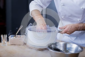 Good cook showing his skills in molecular gastronomy