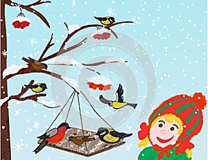 Good deeds. Children feed the birds in winter. Girl and bird feeder