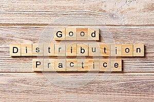 Good distribution practice word written on wood block. good distribution practice text on table, concept