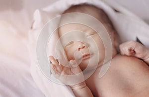 Good dreaming new born baby sleep on white towel