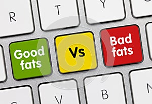 Good fats vs bad fats - Inscription on Green Keyboard Key photo