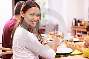 Good food equals good life. A happy couple enjoying a family meal around the table.