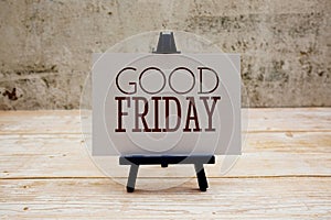 Good Friday text on paper card on wooden background