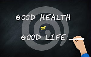 Good Greatly Equal Good Life Conceit On Chalkboard With Human hand Writing text in blackboard . Conceptual Idea of health photo