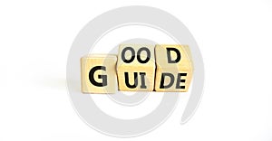 Good guide symbol. Concept words Good guide on wooden cubes. Beautiful white table white background. Good guide and business