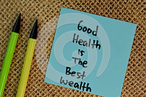Good Health is the Best Wealth write on sticky notes isolated on Wooden Table