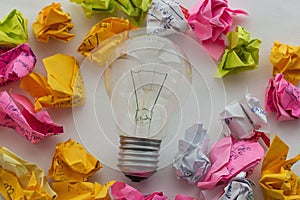 Good idea concept with crumpled colorful paper and light bulb
