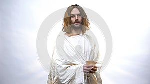 Good Jesus holding wooden cup, religious concept to give drink to thirsty