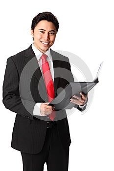 Good looking businessman with a clipboard wearing a white shirt and tie