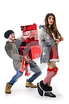 Good looking couple in Santa Claus hat with Christmas gift