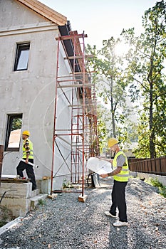 good looking devoted cottage builders working