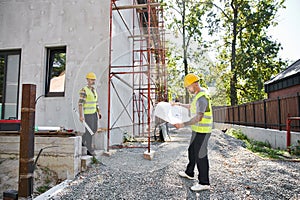 good looking devoted cottage builders working