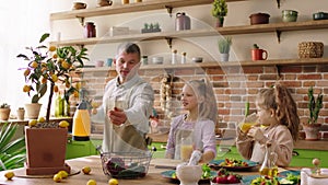 Good looking family charismatic man together with his daughter have fun in the morning before going to work and school