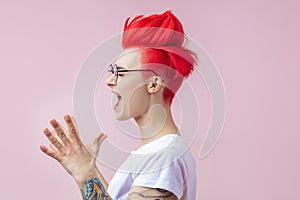 Good looking girl with nonstandard appearance clapping her hands