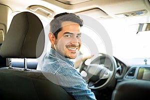 Good looking guy driving car