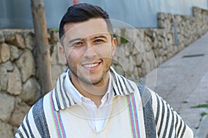 Good looking Hispanic man wearing a ruana photo