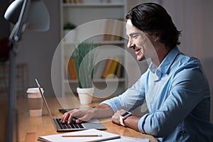 Good looking man working on laptop.