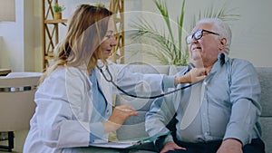 Good looking old man have a health check at home the gp doctor exam the patient using the stethoscope