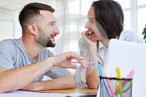 Good-looking pair looking at each other while discussing something